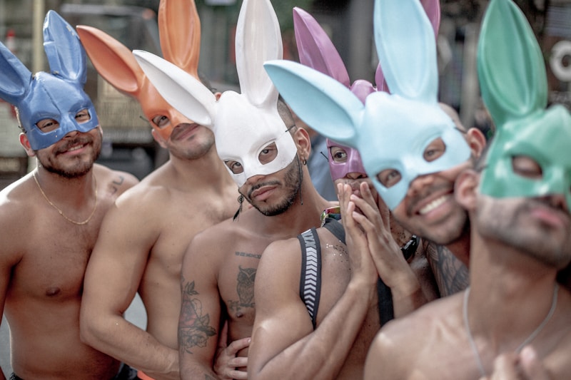 fun-loving gay men in party masks