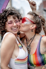 two gay women celebrating their love, rainbow style.