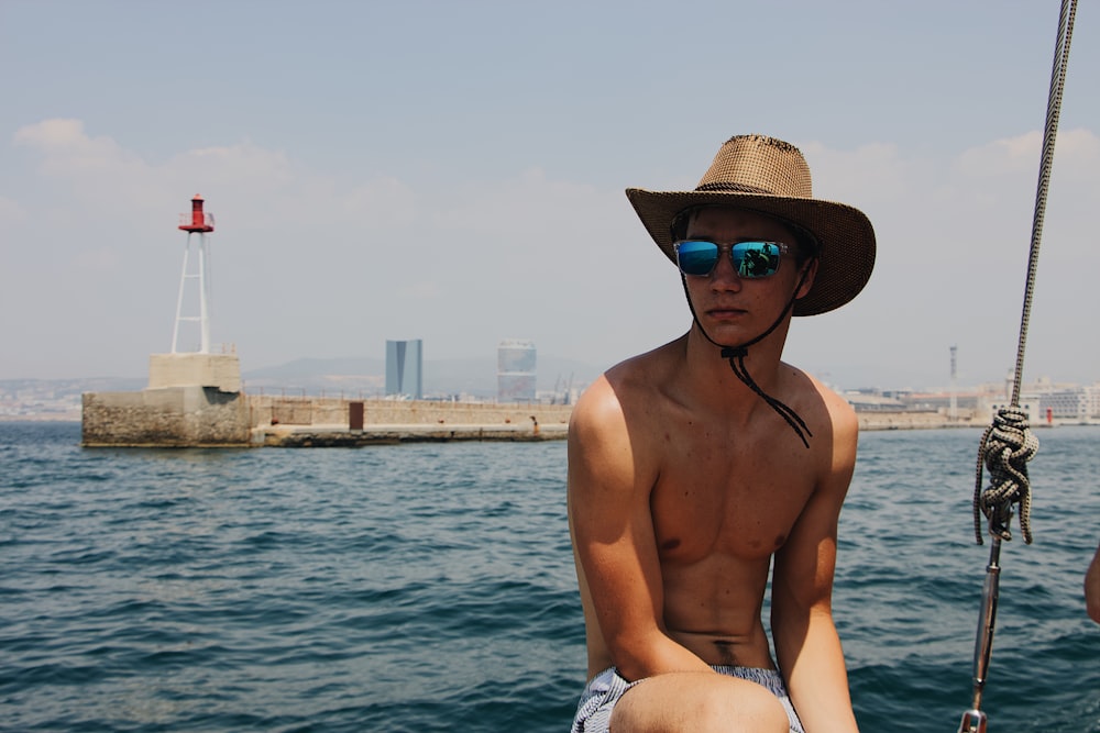 man wearing sunglasses and brown cowboy hat