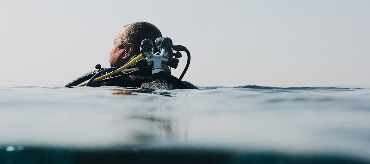 a man in a wet suit is in the water