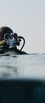 a man in a wet suit is in the water