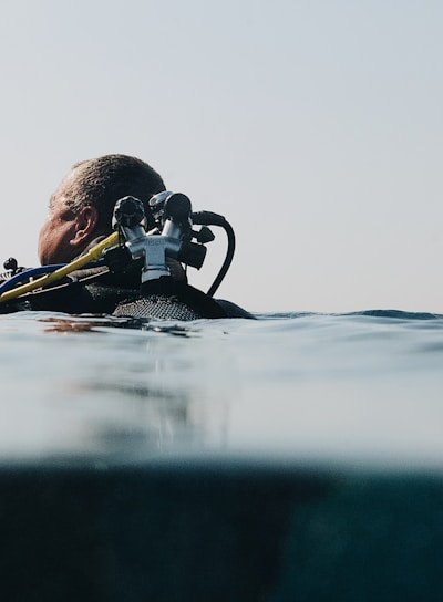 a man in a wet suit is in the water