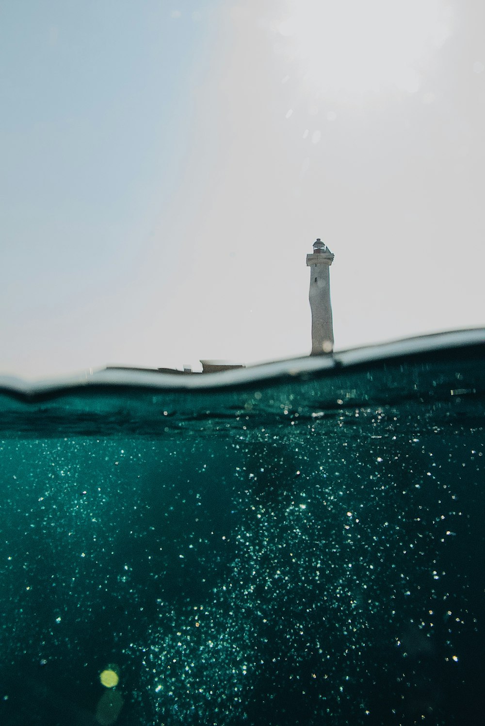 a light house in the middle of the ocean