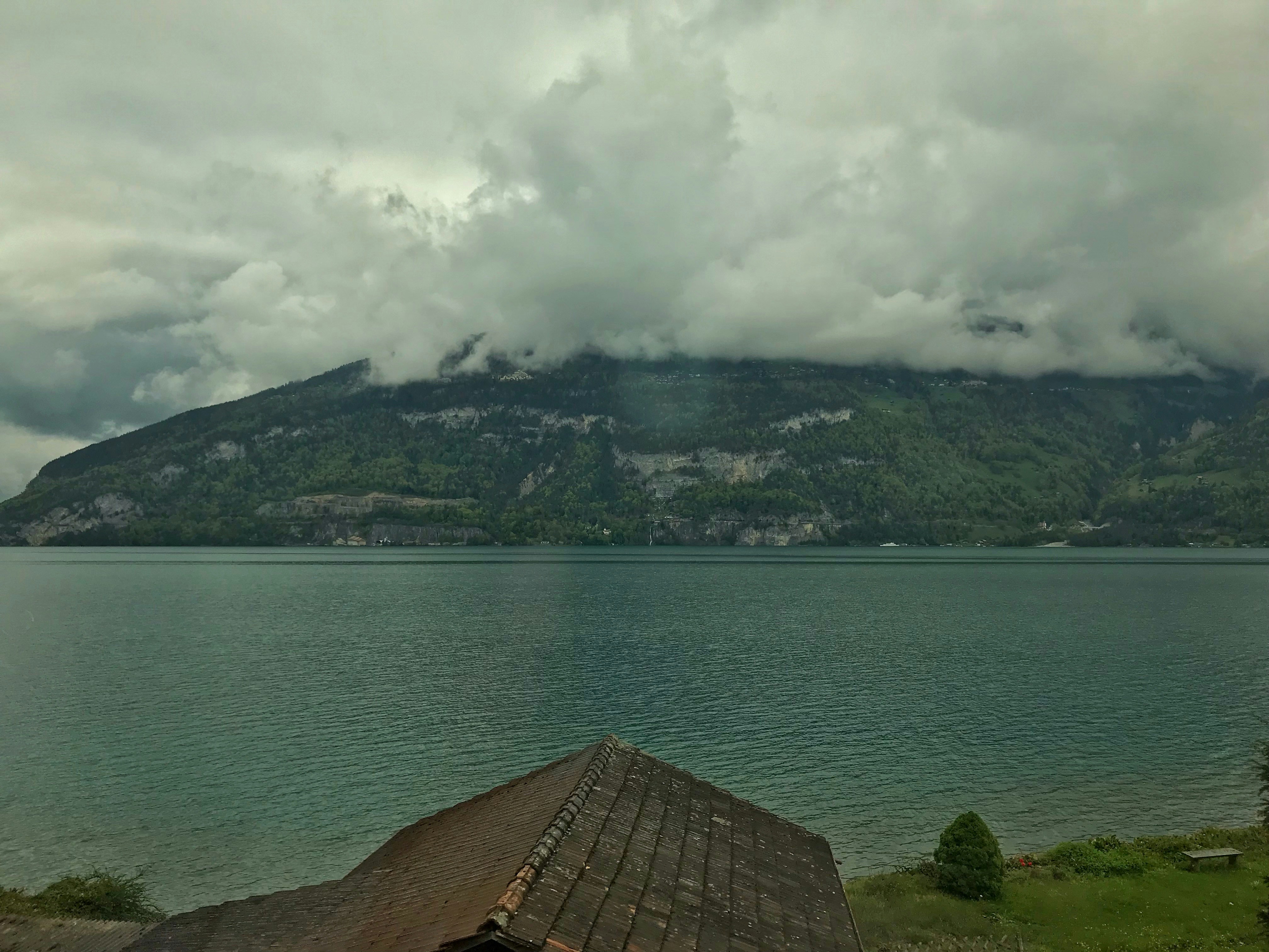 aerial photography of mountain under cloudy sky