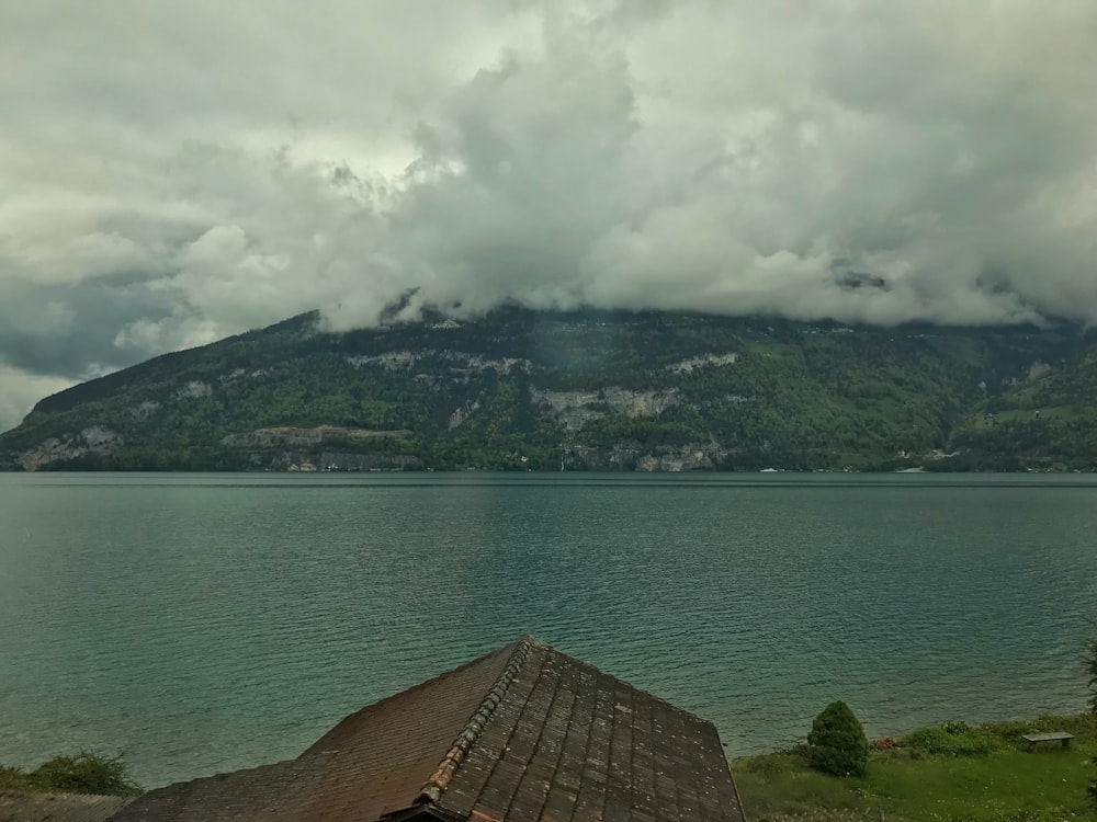 aerial photography of mountain under cloudy sky