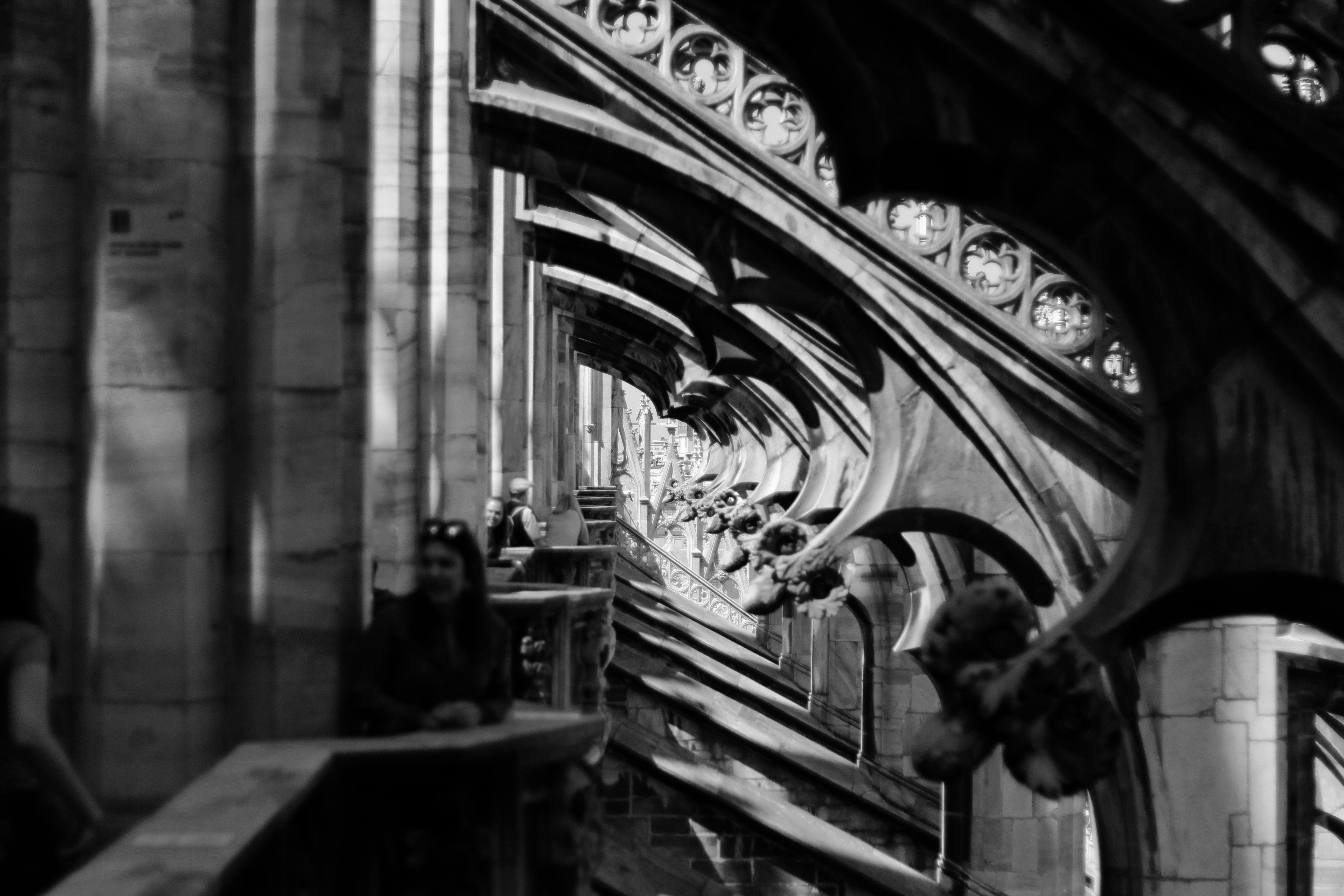 grayscale photography of people inside building