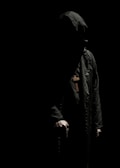 A shadowy figure cloaked in darkness, representing the dark lord.