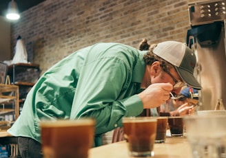 person drinking in a room close-up photography