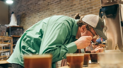 person drinking in a room close-up photography