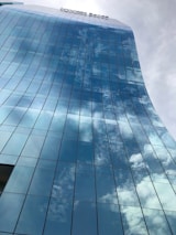 A stunning completed building reflecting the skyline.