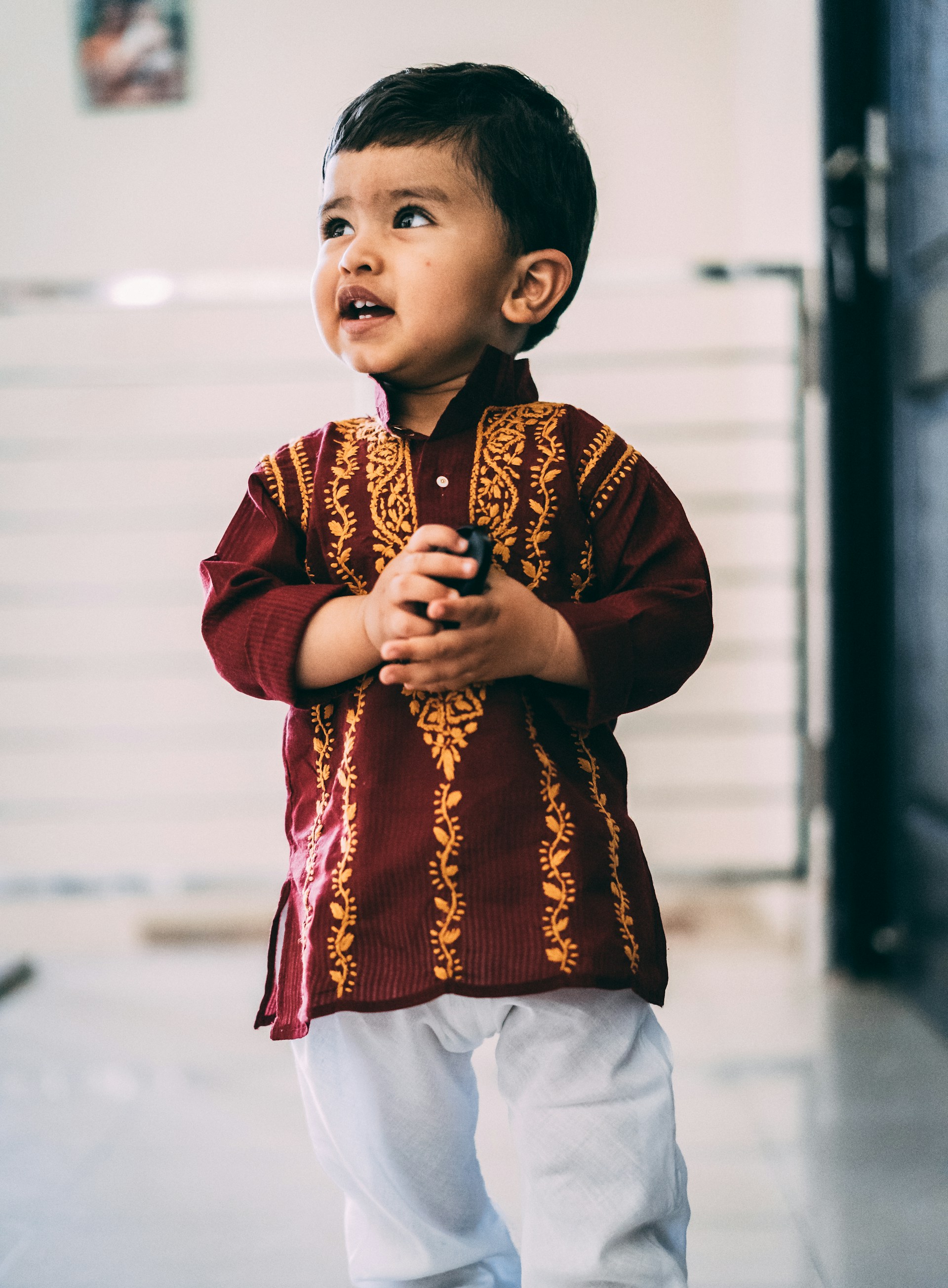 A charming kids' clothing collection showcasing colorful lehengas and playful daily wear, capturing joyful moments in soft natural light.