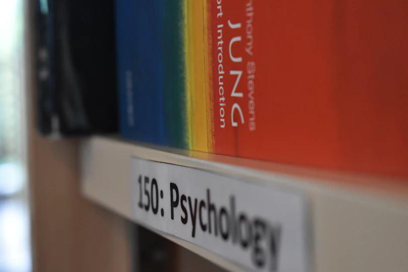 a close up of a book shelf with books on it