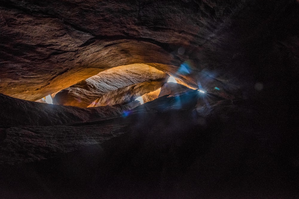 a cave filled with lots of light coming from it