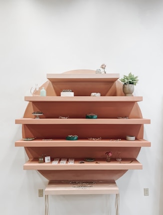 Minimalist shelving unit displaying stylish decor pieces.