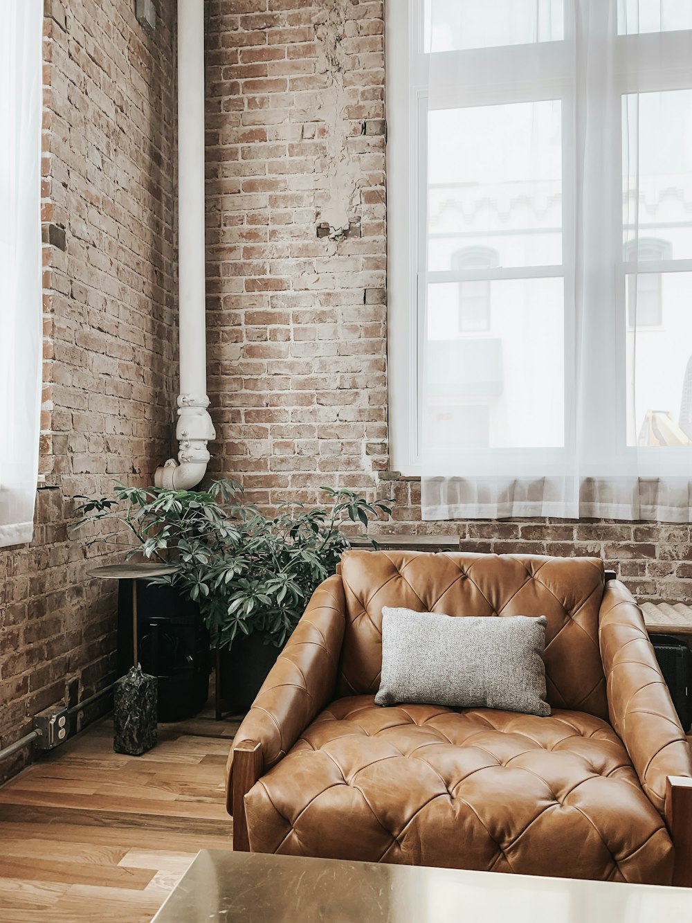 grey pillow on chair