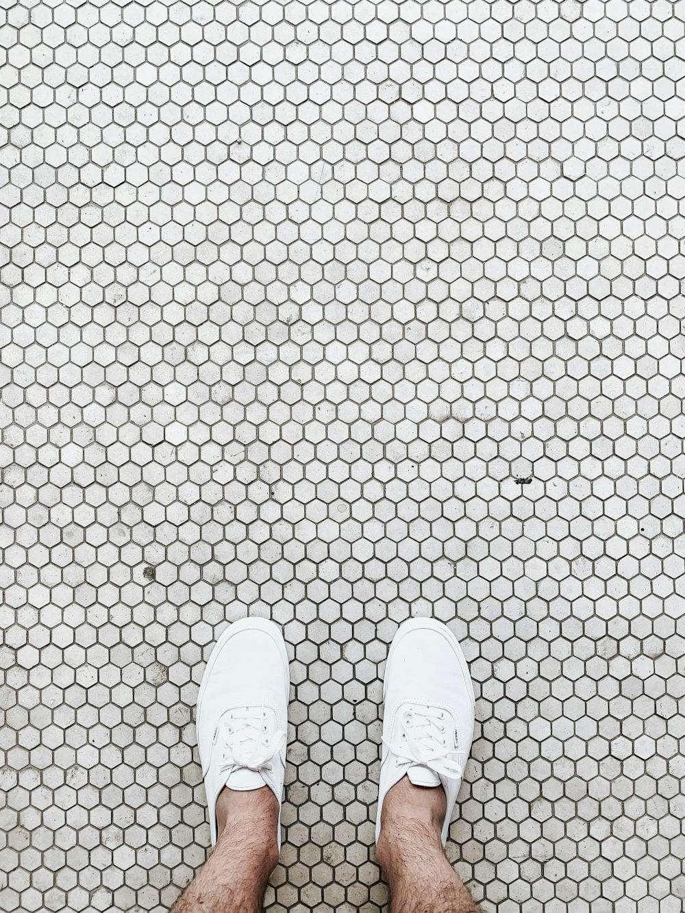 pair of white low-top sneakers