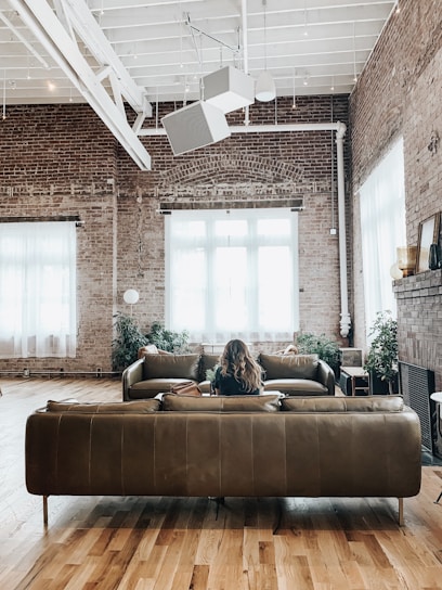 Comfortable sitting area with plush cushions and natural textures in the farmhouse loft.