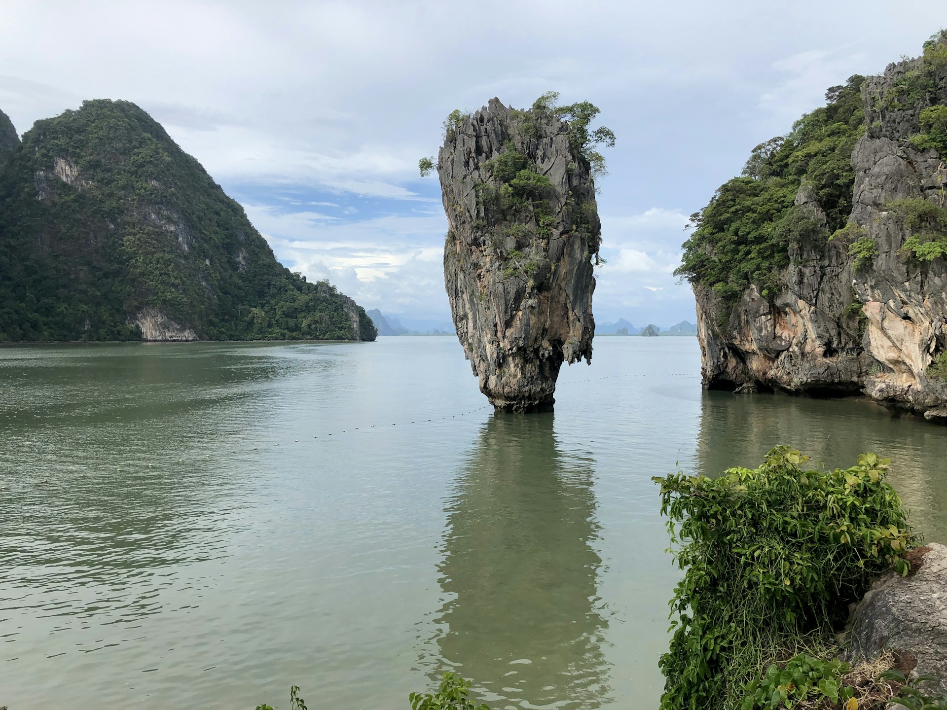 brown rock formation on water