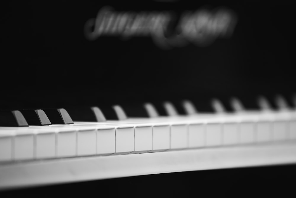 photo of white and black piano