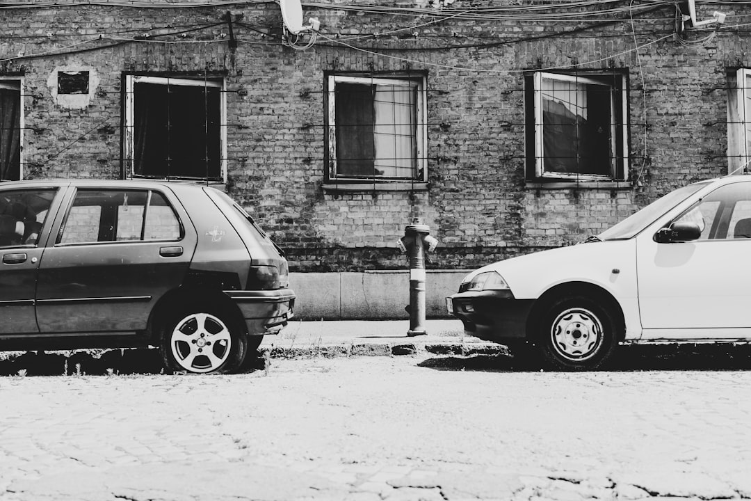 shallow focus photo of parked cars near fire hydrant