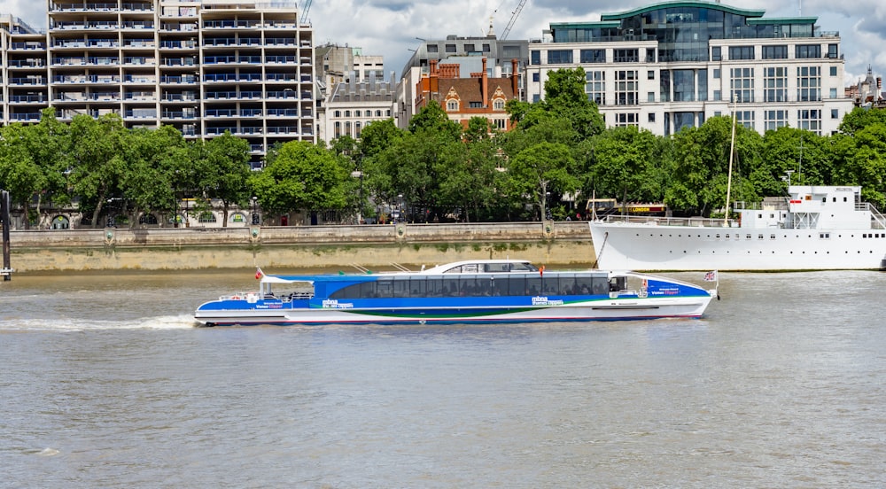 blue boat on body of water