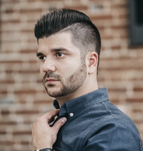 man wearing black button-up long-sleeved shirt