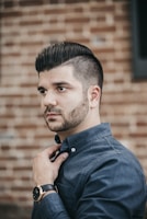 man wearing black button-up long-sleeved shirt