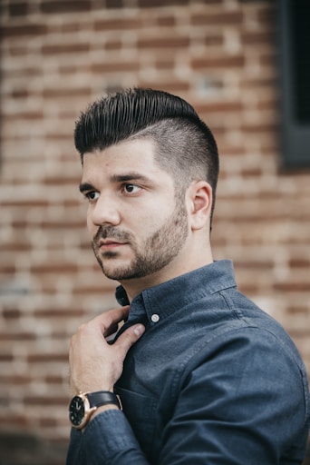 man wearing black button-up long-sleeved shirt
