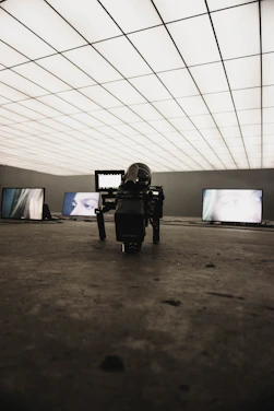 A futuristic studio setup with AI-powered cameras and screens displaying dynamic advertising content.