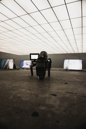 A futuristic studio setup with AI-powered cameras and screens displaying dynamic advertising content.