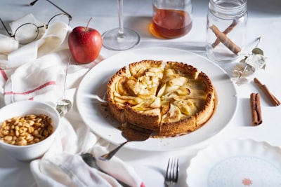 plate of cooked food apple pie teams background