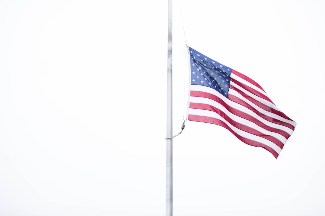 USA flag on grey metal pole