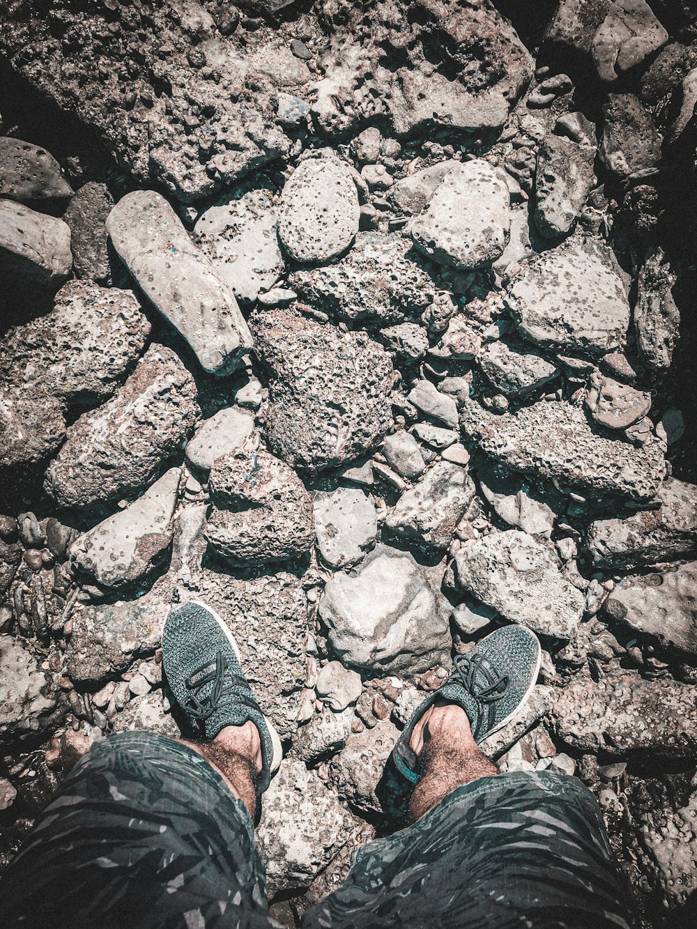 man standing on rocks