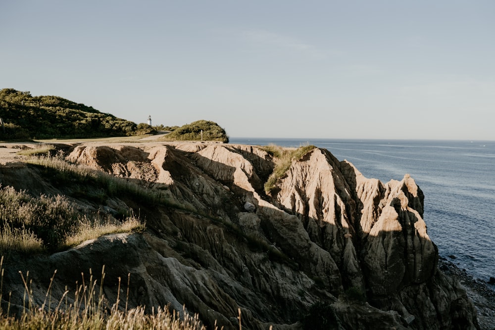 landscape photo of mountains near ocean during daytime