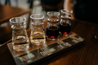 four clear glass containers