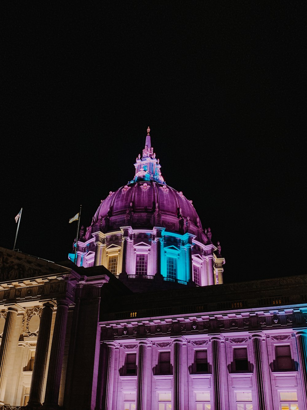 purple lighted dome building at nighttime