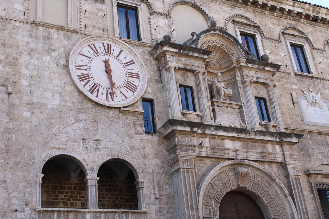building with clock displaying 5:29 time,
