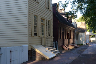 A cozy Saint-Malo street scene with traditional stone houses and wooden shutters.