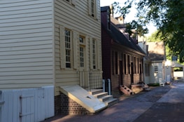 Historic village street lined with old houses and cobblestone paths.