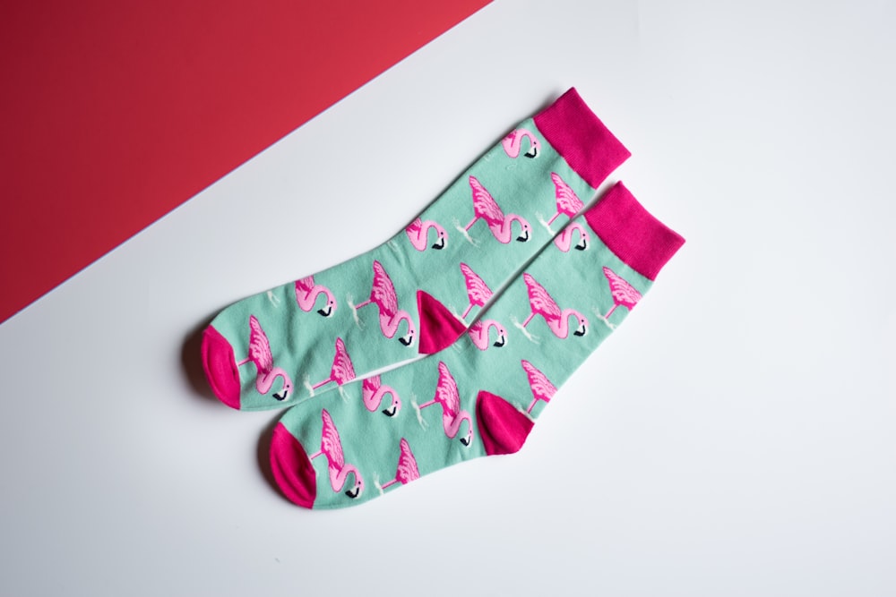 pair of teal-and-pink socks