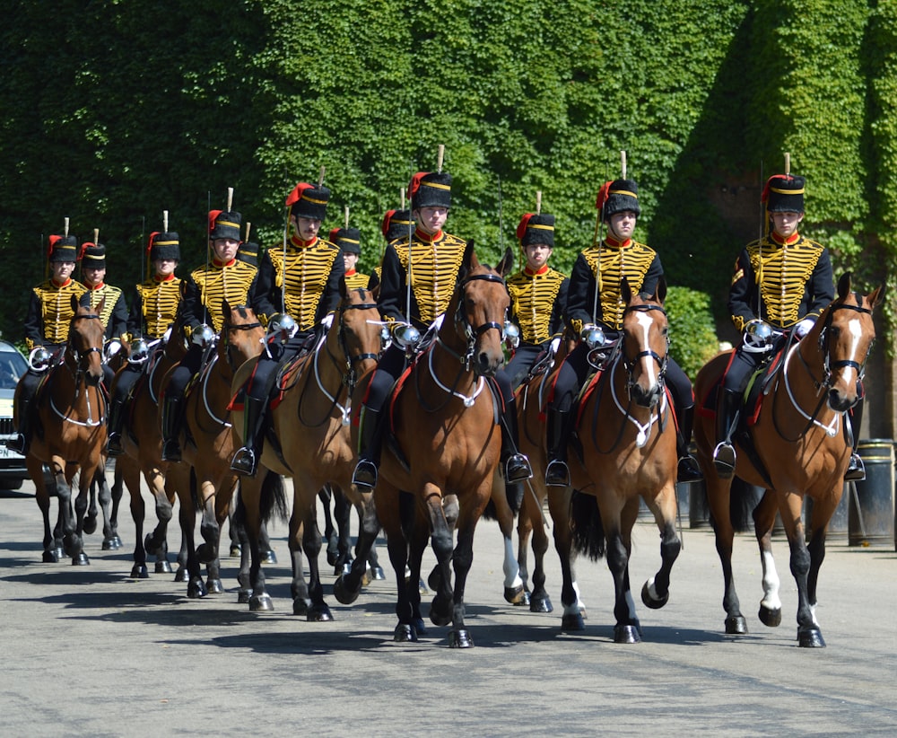 group of people riding horses