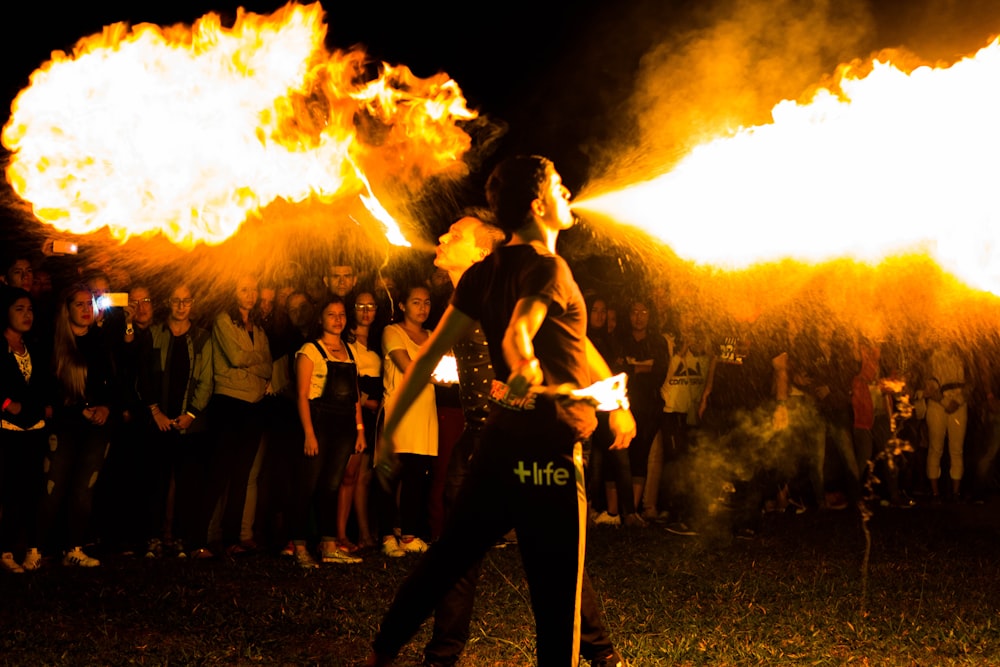 man blowing flame