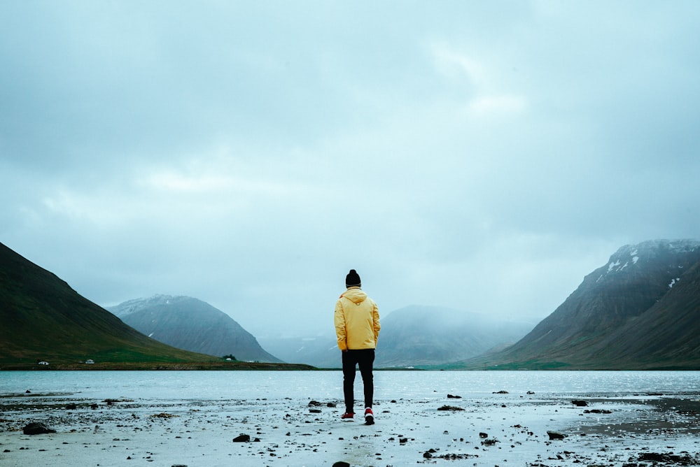 man wearing yellow jacket