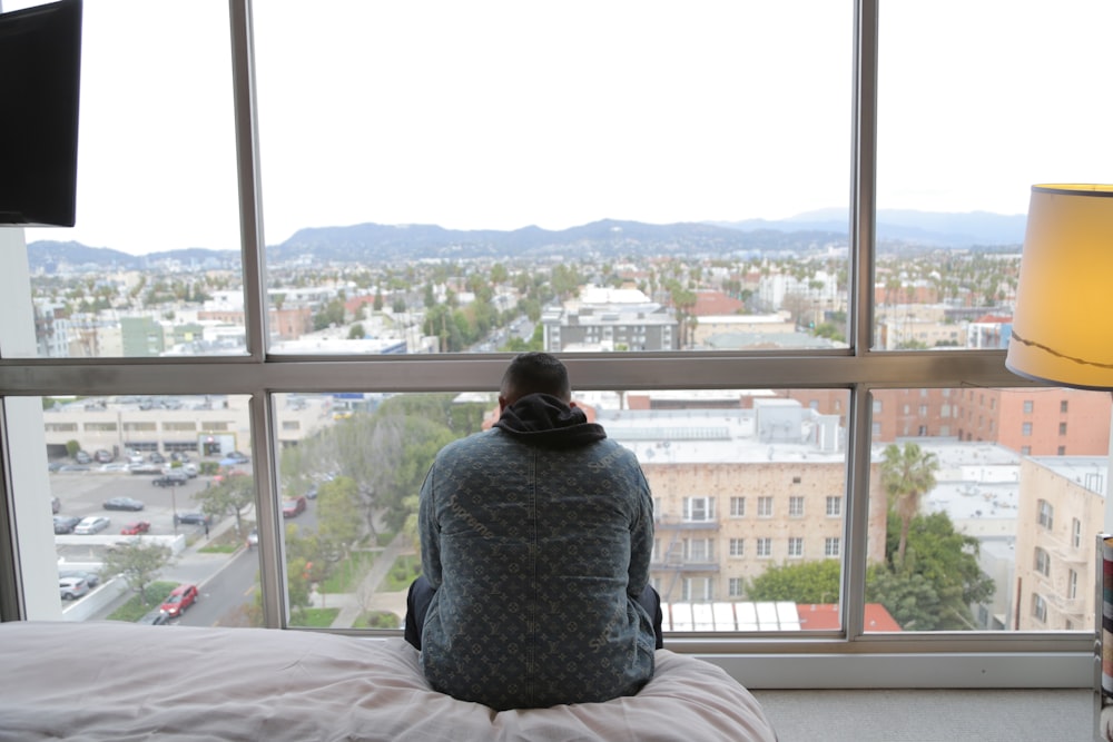 man siting on bed