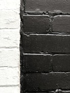 Close-up of freshly cleaned brick facade highlighting contrast with dirty areas