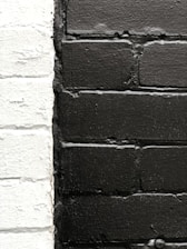 Close-up of freshly cleaned brick facade highlighting contrast with dirty areas