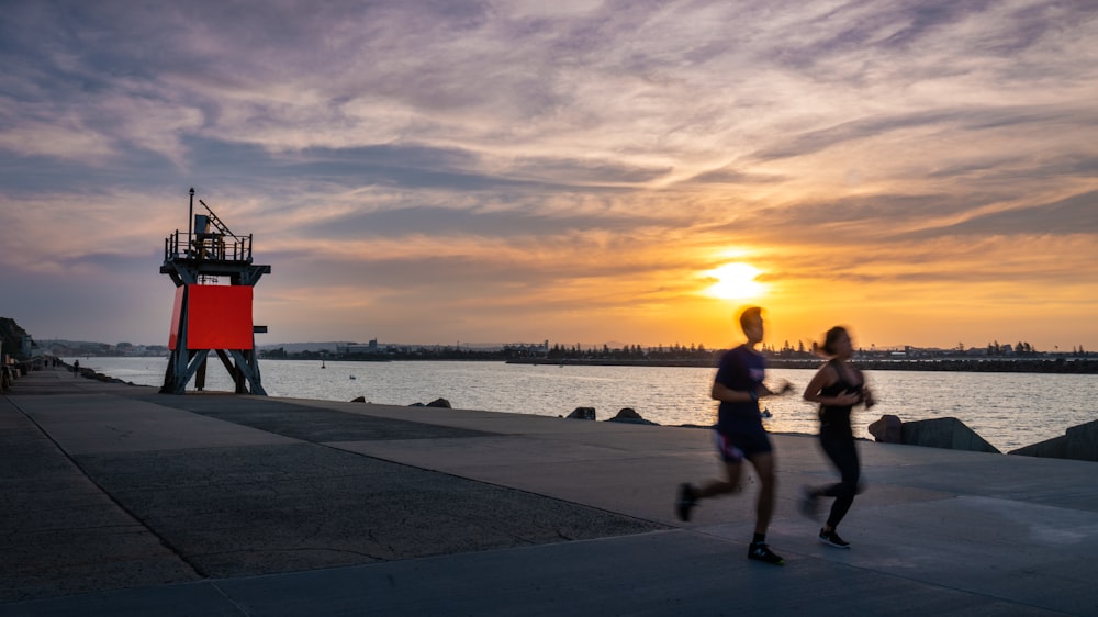 two persons jogging together