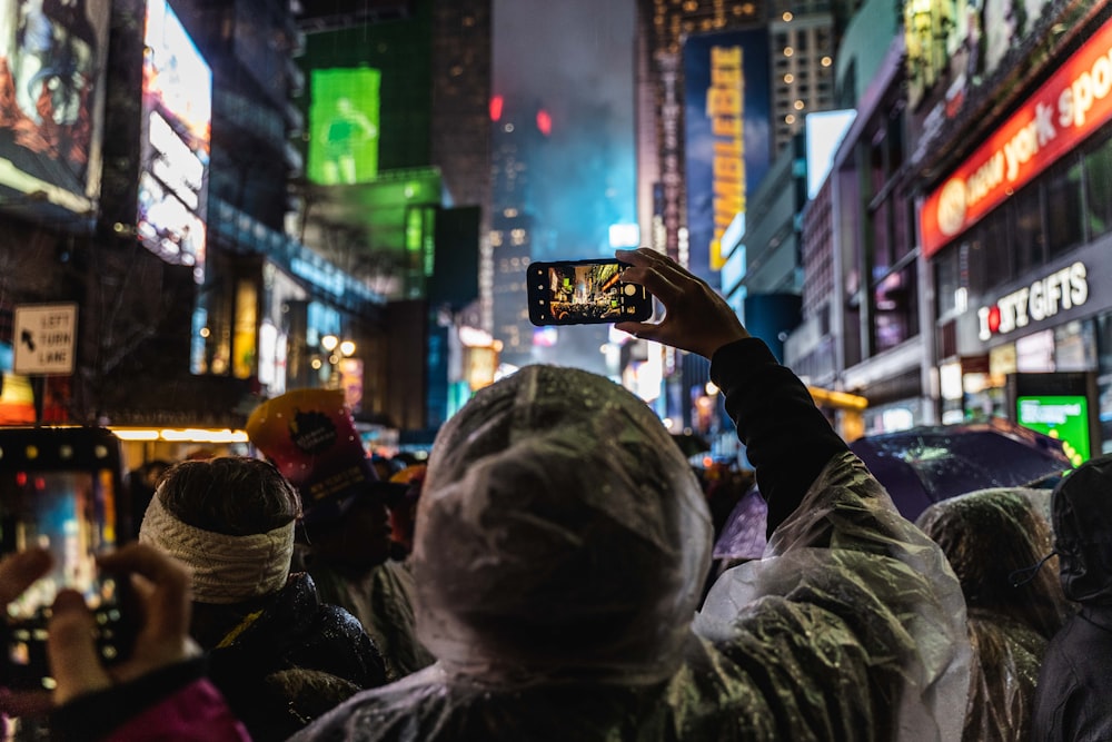 person holding black smartphone