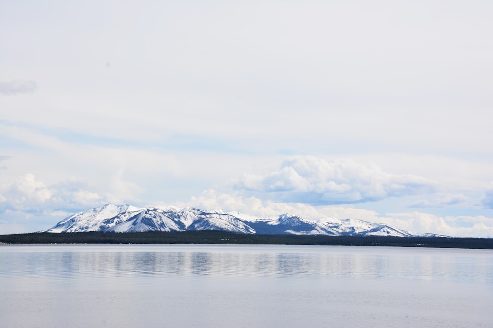 mountain surrounded by sea during daytime