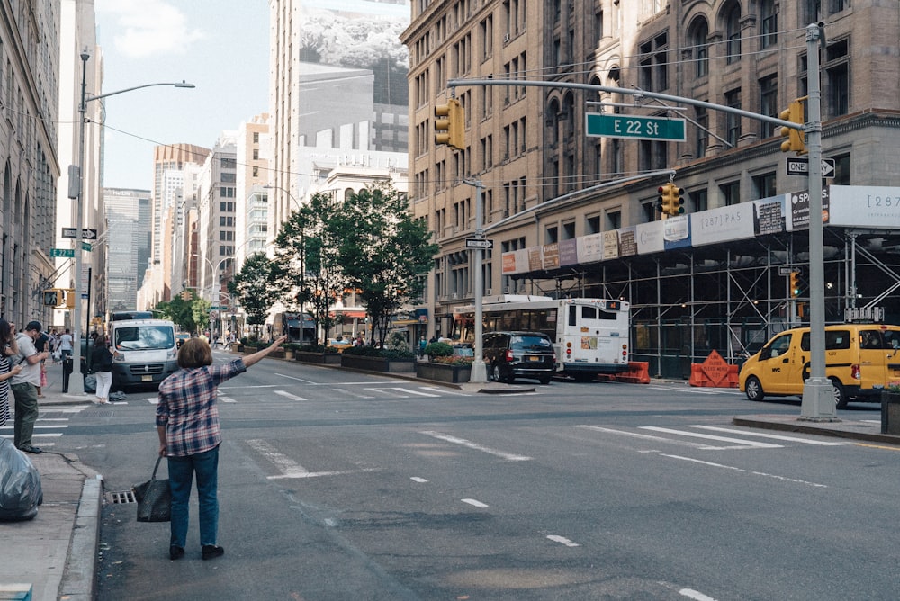 person calling a cab during daytime